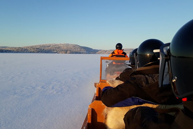 From Ivalo: Ice Fishing Safari to Lake Inari, reindeers & lunch - Borrowing thermal clothes before the lake