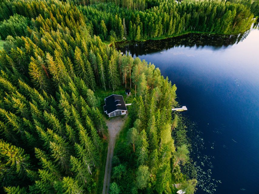 From Rovaniemi: Midnight Sun Forest Lake Float - Shore-side drinks and a small Finnish treat