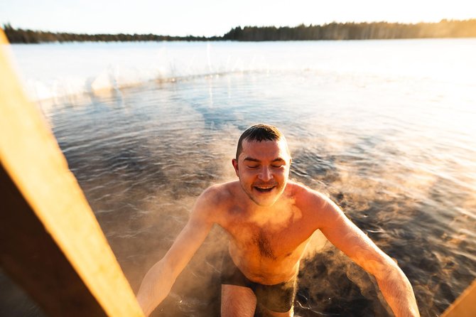 Full Day Lapland Tour, including Lunch and Dinner - Cottage warmth, fire-cooked salmon, and the second meal