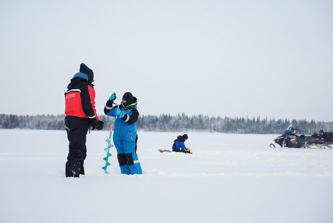 Ice Fishing and Snowmobile Safari Combo in Lapland - Sausages by the fire in the snowy wilderness
