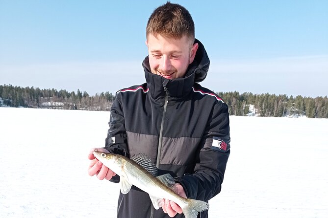 Ice fishing experience with Backpacker Helsinki Tour - Sausage, glögi, and piparri by the fire