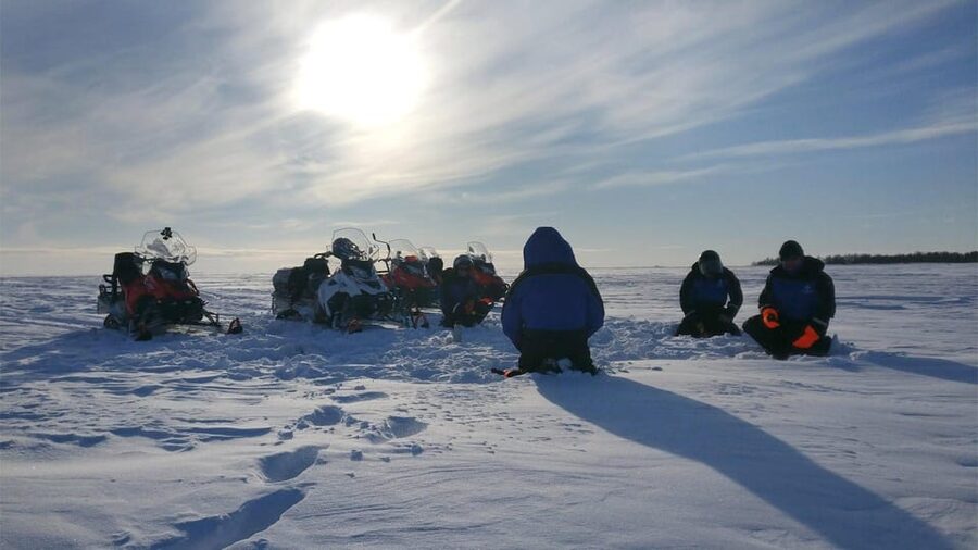 Kemi-Tornio: Ice Fishing Safari with Snowmobiles - Riding a snowmobile over the frozen sea
