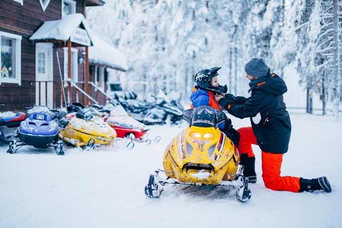 Lapland Family Snowmobile Safari from Rovaniemi - Getting dressed for three hours outside