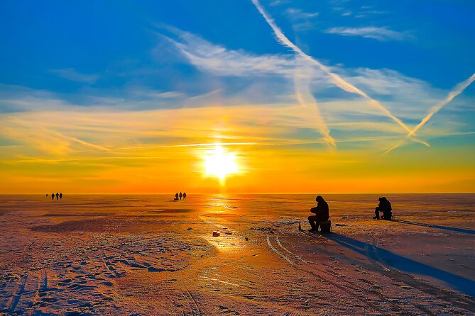 Lapland Ice Fishing Experience from Rovaniemi - Drilling through thick lake ice
