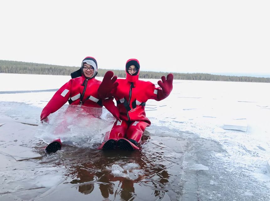 Lapland: Ice Fishing, Floating & BBQ Snow Adventure - Making your first ice-fishing hole