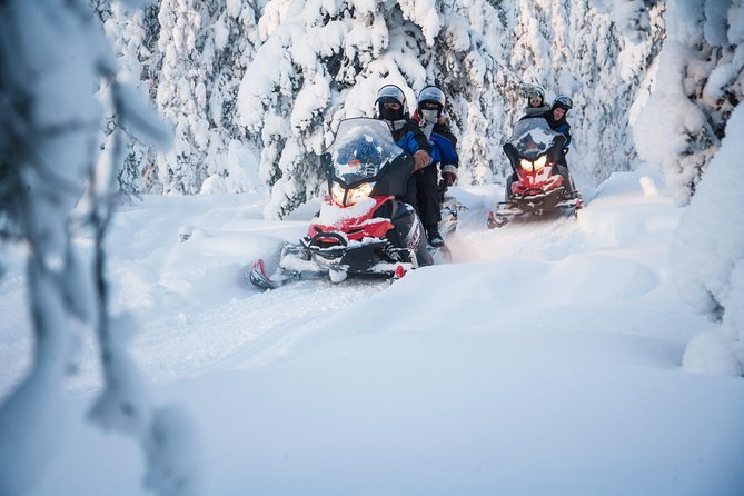 Lappish Lunch Break -Snowmobiling, ice fishing and tasty food - Riding across frozen rivers and snowy forest