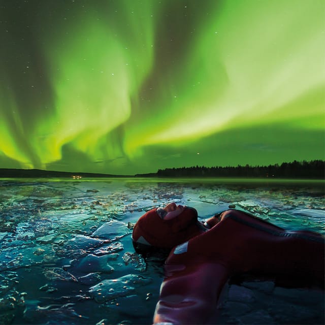Levi: Ice Floating and Northern Lights Tour - Getting ready in the rescue suit