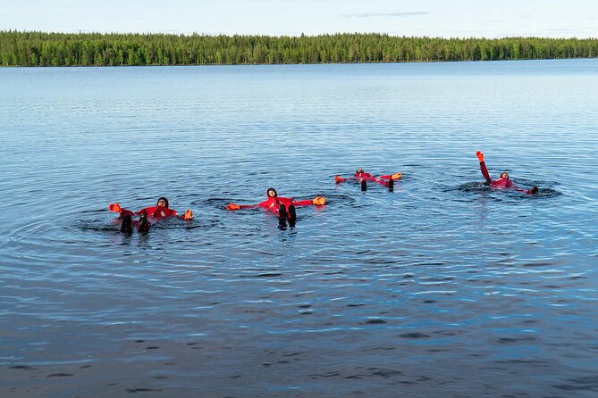 Midnight Sun Floating Experience in Forest Lake - Getting into the floating survival suit