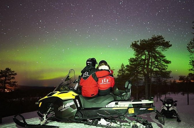 Northern Lights Snowmobile Hunt - A campfire stop with sausages and hot snacks