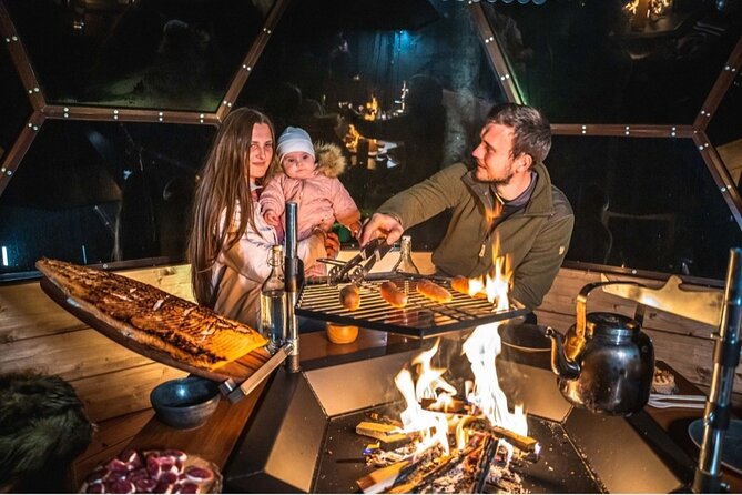 Private Glass Igloo Dinner on the Shore of Frozen Lake - A Warm Glass Igloo in the Arctic Dark