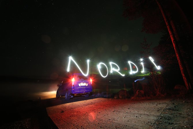 Private Northern Lights Hunting Expedition - Waiting beside the fire, with sausages and hot blueberry drink