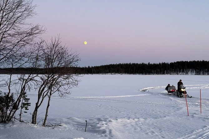 Reindeer Husbandry with Snowmobile Sleigh Ride and Cabin Lunch - Crossing the frozen lake by snowmobile sleigh