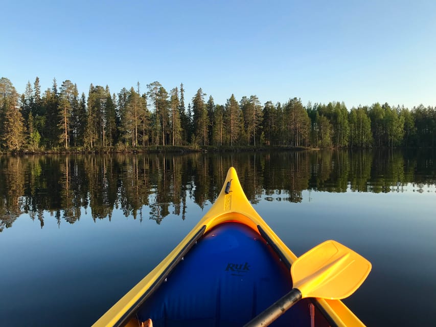 Rovaniemi: All-Day Canoe Adventure - Paddling across quiet lake water
