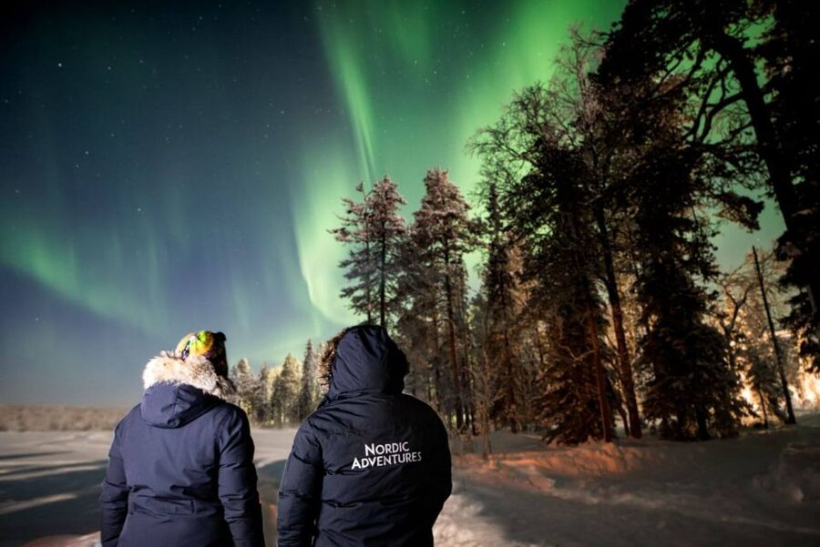 Rovaniemi: Arctic Ice Floating and Northern Lights Tour - Putting on the thermal rescue suit