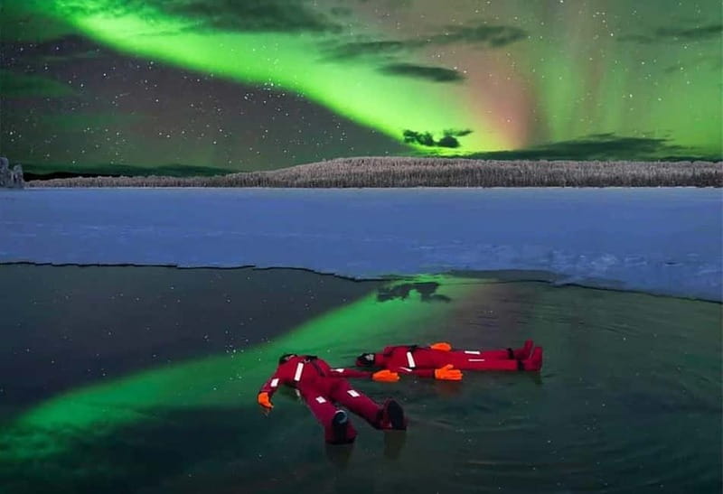 Rovaniemi: Ice Floating in Forest Lake with Aurora Borealis - Getting dressed in the floating suit
