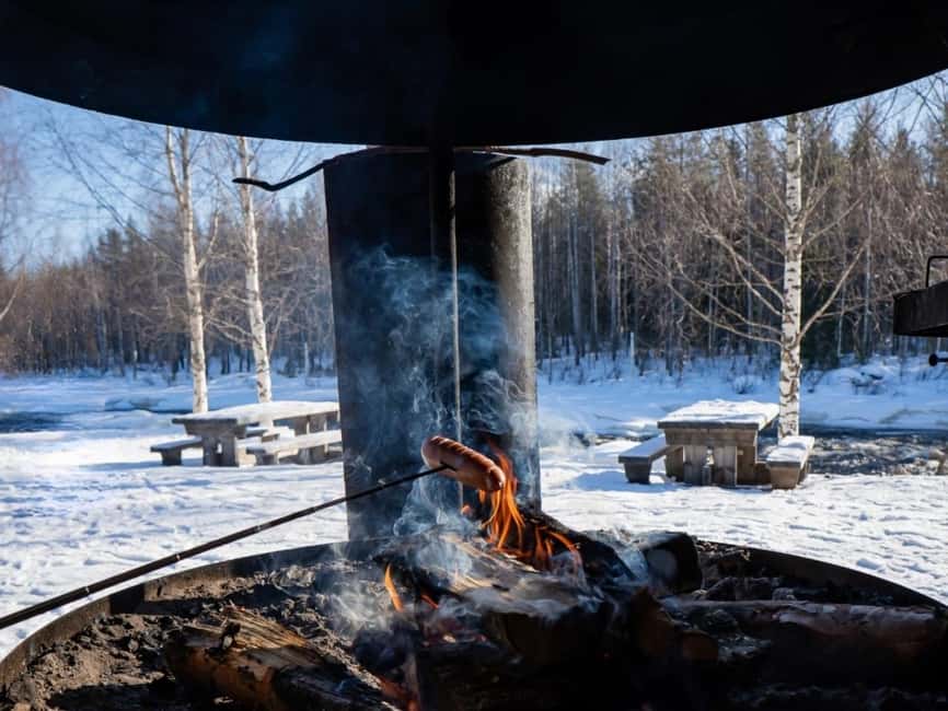 Rovaniemi: Snowshoe Adventure at Vikaköngäs & Barbeque - A forest barbecue with hot drinks and grilled sausages