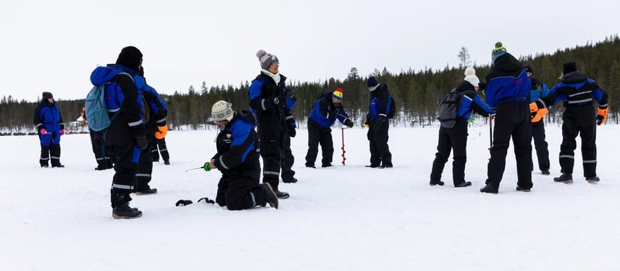 Saariselkä: Ice Fishing Safari by Snowmobile - A campfire lunch with guide Anni