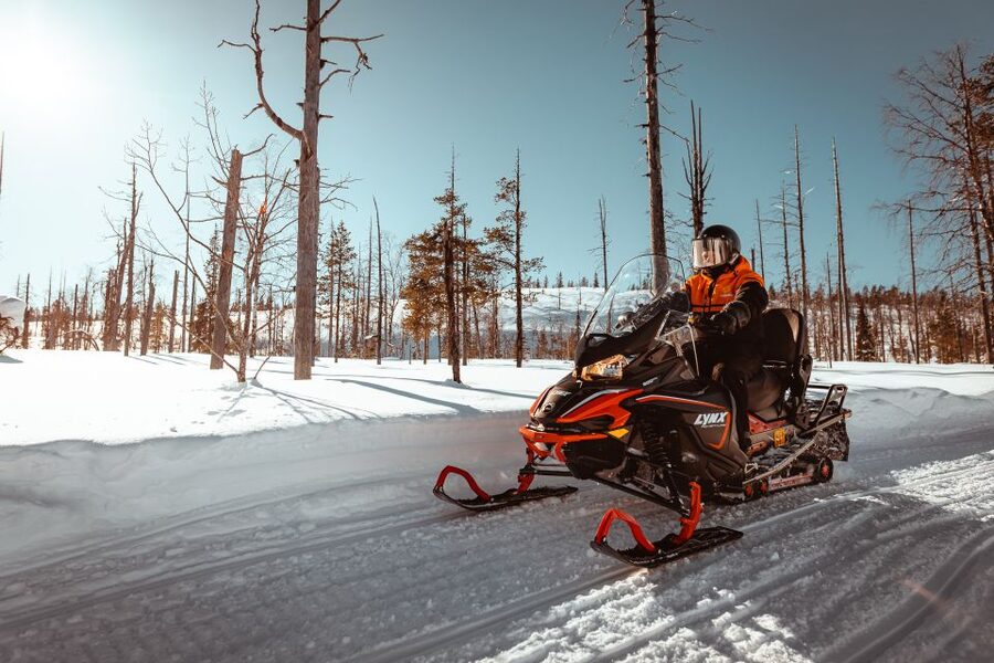 Saariselkä: Snowmobile Adventure for Adults - Riding two people to a snowmobile
