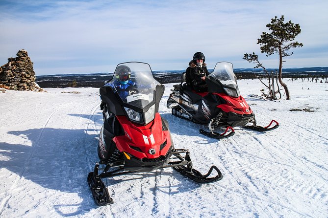 Snowmobile Safari in the Forest - Looking for tracks in the snow