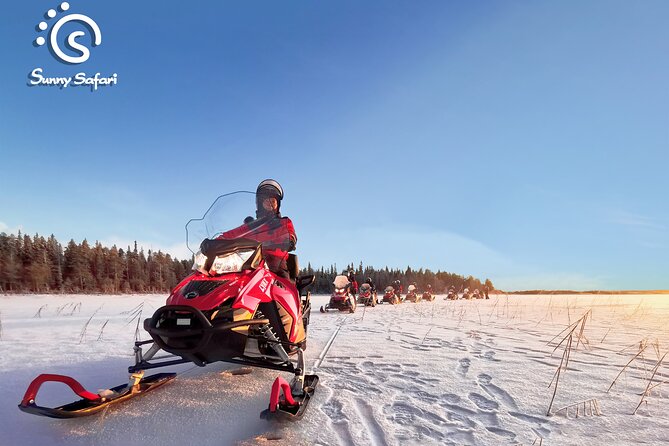 Snowmobile Whole Day Adventure - Small Group - Following the guide through Lapland countryside