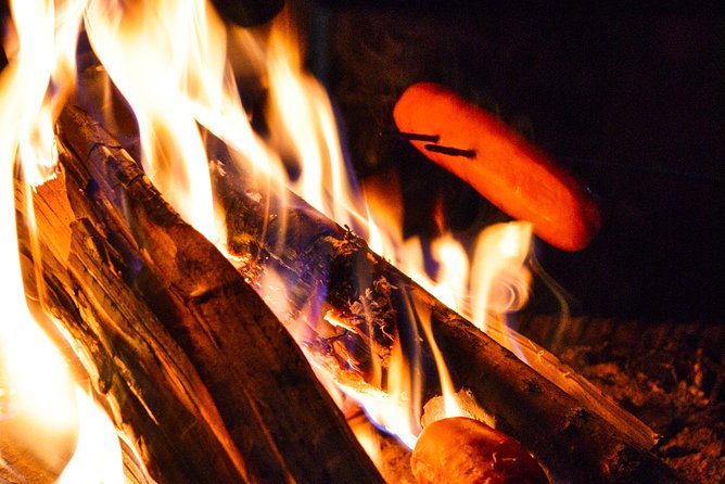 Sunset at the Arctic Circle - Fire, snacks, and a Lappish tepee