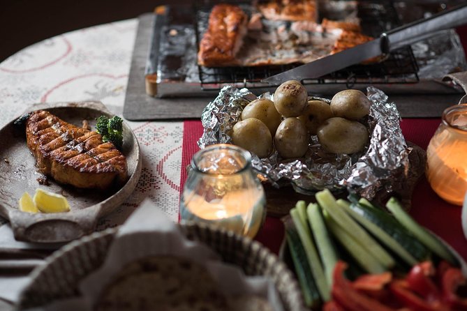Traditional Lappish evening in the wilderness with dinner - Smoked salmon by an open fire