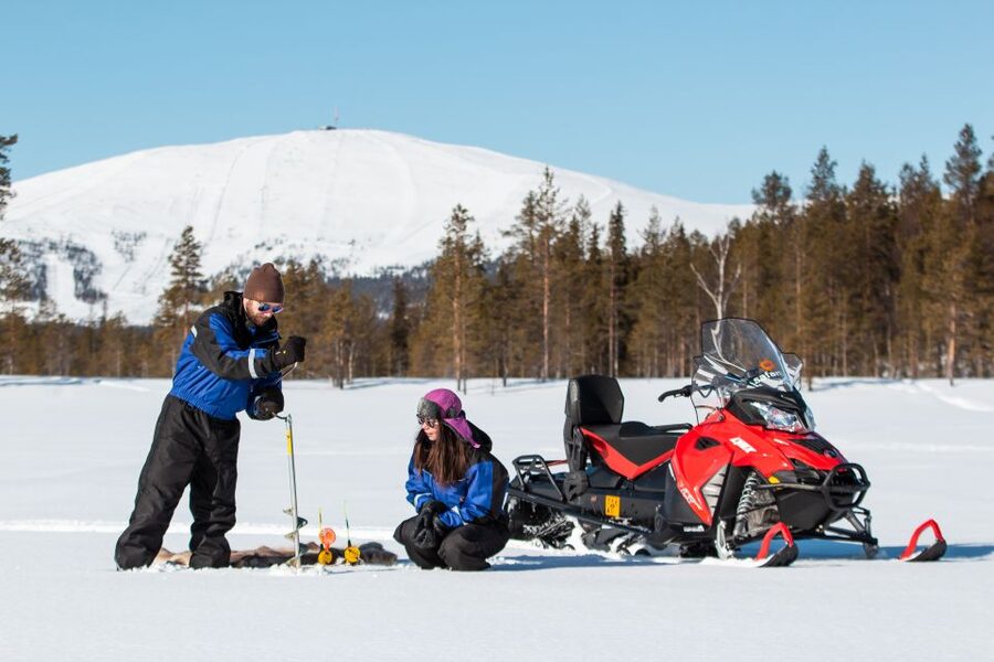 Ylläs: Snowmobile Adventure with Ice Fishing - Learning ice fishing on a frozen lake