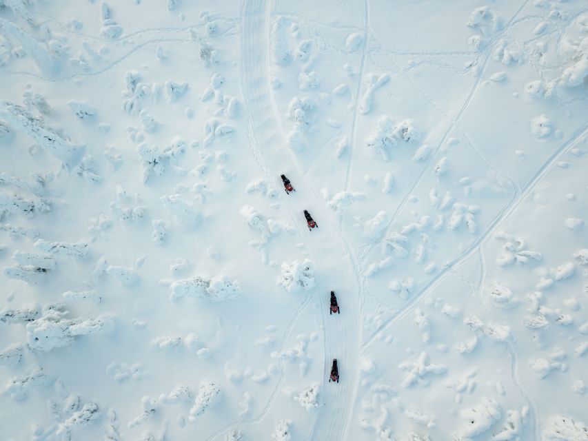 Ylläs: Snowmobile Adventure with Ice Fishing - Fire-cooked soup in a lakeside tipi